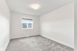 Neutral wall color, carpeted flooring, window with blinds, and flush mount ceiling light - 