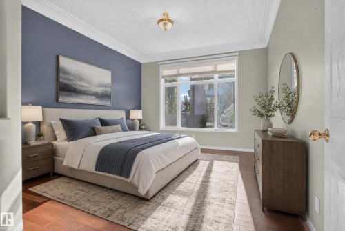 Room featuring wood-finish flooring, crown molding, multi-pane window, and decorative ceiling-mounted light fixture - 876 Twin Brooks Close Nw, Edmonton, AB 
