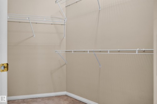 Storage area featuring white wire shelving and neutral wall tones - 876 Twin Brooks Close Nw, Edmonton, AB 