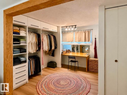 Built-in custom closet system with open shelving and drawers - 5 Gilmore Crescent, St. Albert, AB 