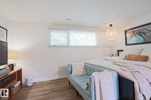 Wood-finish flooring, white walls, and a window with blinds - 5 Gilmore Crescent, St. Albert, AB 