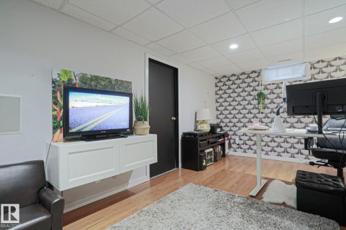 Recessed lighting illuminates wood-finish flooring - 5 Gilmore Crescent, St. Albert, AB 