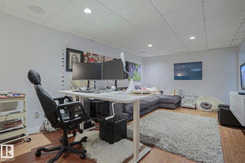 Wood-finish flooring, recessed lighting, drop ceiling, and neutral wall tones - 5 Gilmore Crescent, St. Albert, AB 