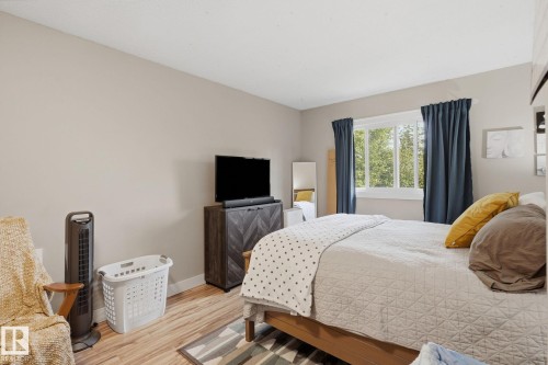 Wood-finish flooring with neutral wall paint - 5340 38A Avenue Nw, Edmonton, AB 