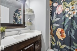 Bathroom vanity with a white countertop and integrated sink - 