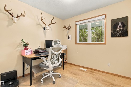 Wood-finish flooring with a window offering exterior views - 51064 Rge Rd 222, Rural Strathcona County, AB 