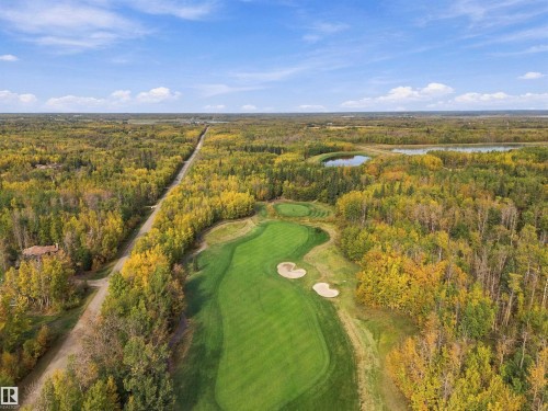 Expansive golf course frontage with manicured greens and sand traps - 51064 Rge Rd 222, Rural Strathcona County, AB 