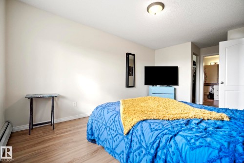 Wood-finish flooring throughout - #416 111 Edwards Dr Sw, Edmonton, AB 