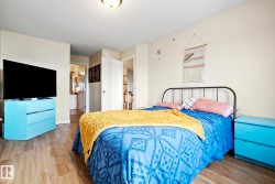 Wood-finish flooring, white walls, and a white ceiling light fixture - 