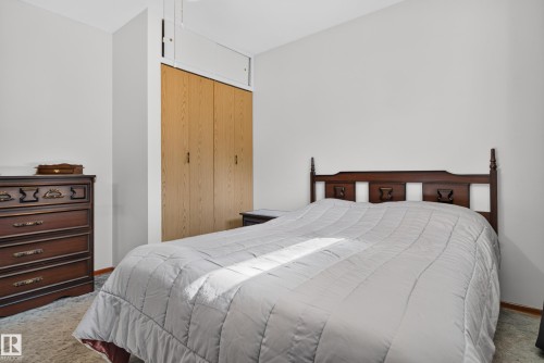 Integrated wood-finish closet with overhead storage - 14 Sonora Drive, St. Albert, AB 