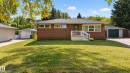 Brick exterior with a gabled roof and white railings - 14 Sonora Drive, St. Albert, AB 