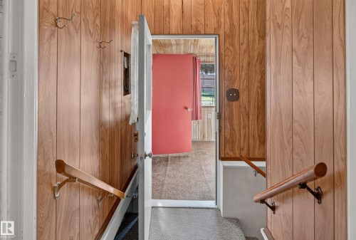 Wood-panel wall finishes throughout the entry - 14 Sonora Drive, St. Albert, AB 