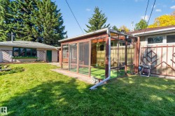 Screened-in enclosure with a pitched roof - 