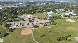 Expansive green spaces with multiple sports fields and a baseball diamond - 