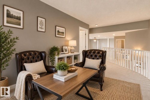 Neutral wall palette with white spindled balcony railing and recessed lighting - 225 Heagle Crescent Nw, Edmonton, AB 