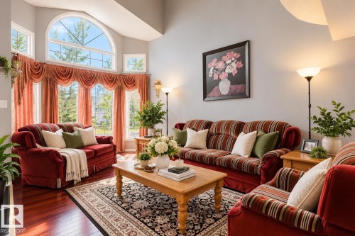 Vaulted ceilings, expansive bay window with arched transom, and polished wood-finish flooring - 225 Heagle Crescent Nw, Edmonton, AB 