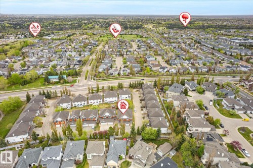 Aerial perspective of a developed residential area with multiple detached and attached properties - 2550 Rabbit Hill Road Nw, Edmonton, AB 