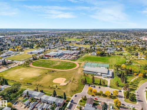 Aerial perspective showcasing a broad urban landscape with residential areas and community amenities - 7520 130 Avenue Nw, Edmonton, AB 
