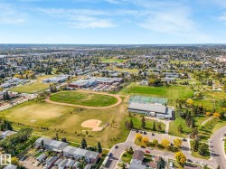 Aerial perspective showcasing a broad urban landscape with residential areas and community amenities - 