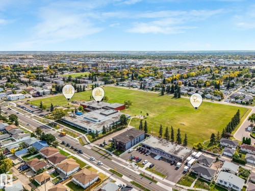 Aerial perspective highlighting surrounding urban landscape and residential properties - 7520 130 Avenue Nw, Edmonton, AB 