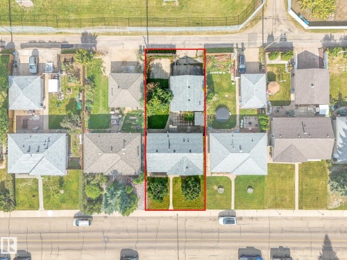 Property with two separate structures and green spaces - 7520 130 Avenue Nw, Edmonton, AB 