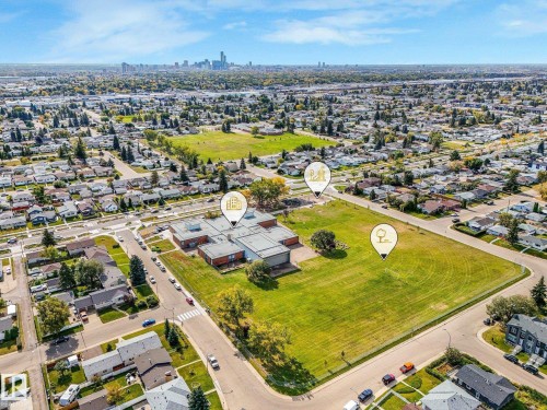 Aerial perspective showcasing urban surroundings with a distant city skyline - 7520 130 Avenue Nw, Edmonton, AB 
