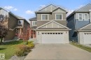Two-story home with a two-car garage, stone and siding exterior, and a concrete driveway - 3699 Hummingbird Way Nw, Edmonton, AB 