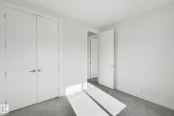 Neutral color palette, wall-to-wall carpeting, contemporary interior doors, and modern door hardware - 
