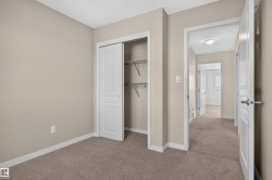Neutral-toned walls complement plush carpet flooring - 