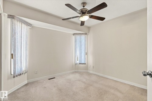 Recessed lighting with a ceiling fan, light-toned walls, and soft carpet flooring - 771 Johns Road Nw, Edmonton, AB 