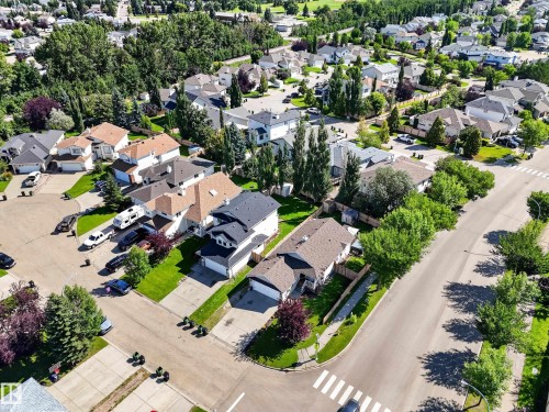 Residential neighborhood with mature trees, paved streets, and a mix of single-family homes - 14 Wells Court, Leduc, AB 