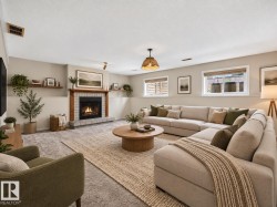 Fireplace with brick surround and wood mantel - 