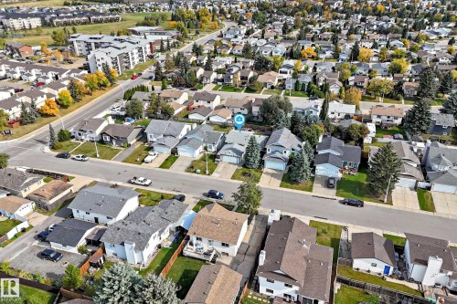 Residential street with detached homes, mature trees, and landscaping - 14519 32 Street Nw, Edmonton, AB 