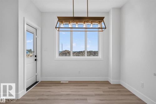 Wood-finish flooring, white walls, and a multi-pane window - 101 Rosa Crescent, St. Albert, AB 