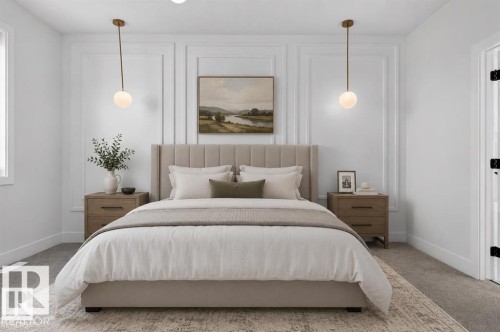 Accent wall with decorative panel molding, dual spherical pendant lighting, and neutral tone carpeting - 101 Rosa Crescent, St. Albert, AB 