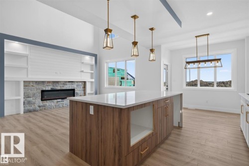 Open concept living area featuring wood-finish flooring - 101 Rosa Crescent, St. Albert, AB 