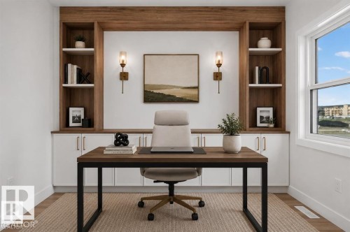 Built-in shelving with wood-finish accents, integrated cabinetry, wall sconces, wood-finish flooring, and a large window - 101 Rosa Crescent, St. Albert, AB 
