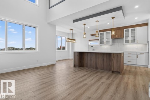 Open-concept living space with wood-finish flooring - 101 Rosa Crescent, St. Albert, AB 