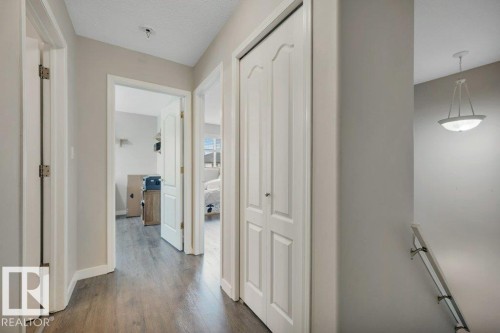 Vinyl plank flooring throughout, white interior doors, and a bi-fold closet door - 11448 169 Avenue Nw, Edmonton, AB 
