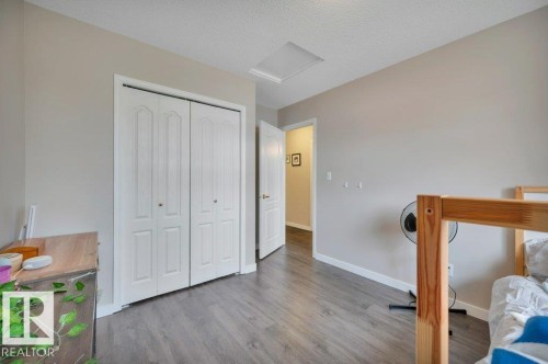 Vinyl Plank flooring with light neutral walls and white trim - 11448 169 Avenue Nw, Edmonton, AB 
