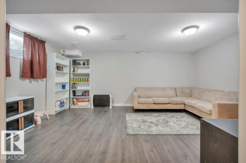 Vinyl plank flooring, neutral toned walls, and built-in ceiling lighting - 11448 169 Avenue Nw, Edmonton, AB 