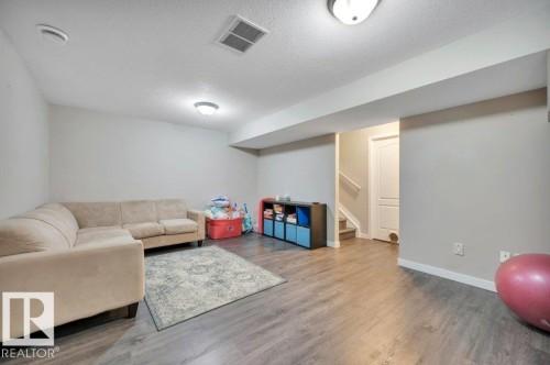 Vinyl plank flooring throughout, complemented by recessed lighting - 11448 169 Avenue Nw, Edmonton, AB 