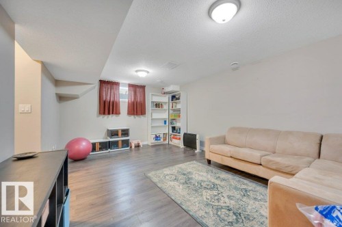 Recessed ceiling lighting, vinyl plank flooring, built-in shelving, and neutral wall tones - 11448 169 Avenue Nw, Edmonton, AB 
