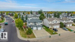 Residential neighborhood with mature trees and paved streets - 