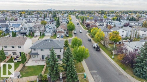 Aerial perspective of a residential neighborhood with a distant cityscape - 11448 169 Avenue Nw, Edmonton, AB 