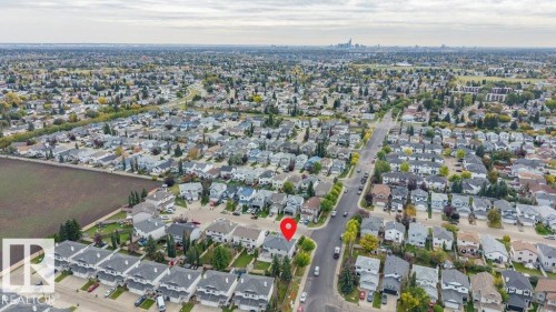 Aerial perspective of a residential neighborhood with a distant cityscape - 11448 169 Avenue Nw, Edmonton, AB 