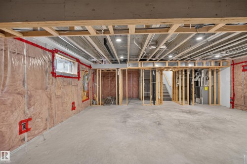 Unfinished lower-level space featuring concrete flooring, exposed joist ceilings, inset lighting, framed wall partitions, and an integrated mechanical system - 7 Bremner, Fort Saskatchewan, AB 