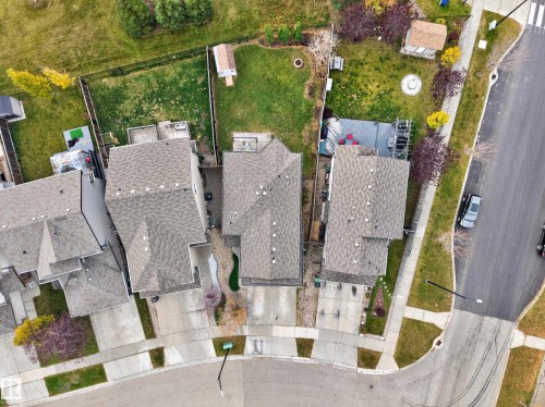 Aerial perspective featuring asphalt shingle roofing, concrete driveways, and fenced rear yards - 7 Bremner, Fort Saskatchewan, AB 