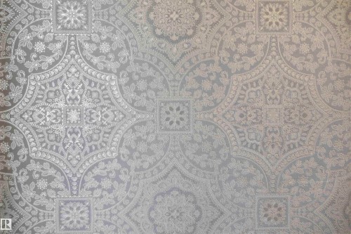 Intricate, embossed wall covering featuring a repeating monochromatic damask pattern - 2045 209A St Nw, Edmonton, AB 
