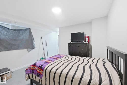 Neutral wall tones and flush-mount ceiling lighting - 4 1920 Millwoods Rd E Nw, Edmonton, AB 